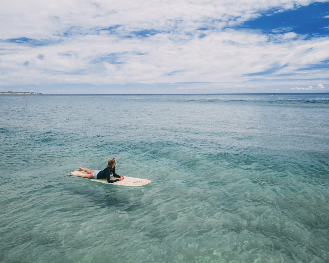 Woman surfing in Asturias